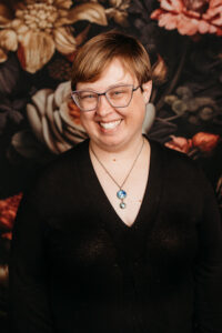 Photo of Rachelle Morgan in front of floral background 