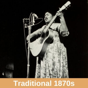 Black and white photo of Odetta, a black woman wearing a dress with short hair, playing an acoustic guitar and singing into a microphone on a stand. Genre label reads "Traditional 1870s."